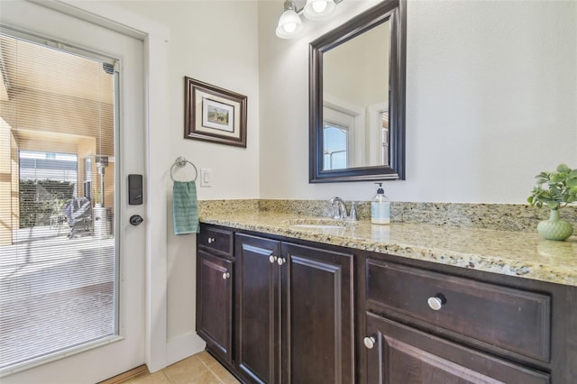 bathroom with tile patterned flooring and vanity