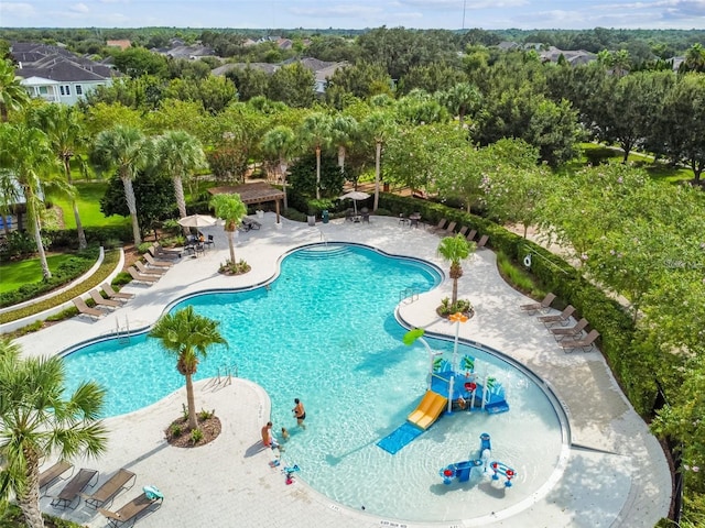 pool with a patio area, a water play area, and a gazebo