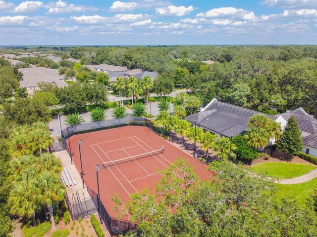 bird's eye view featuring a wooded view