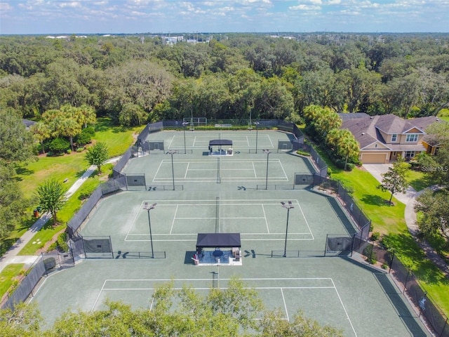 birds eye view of property with a forest view