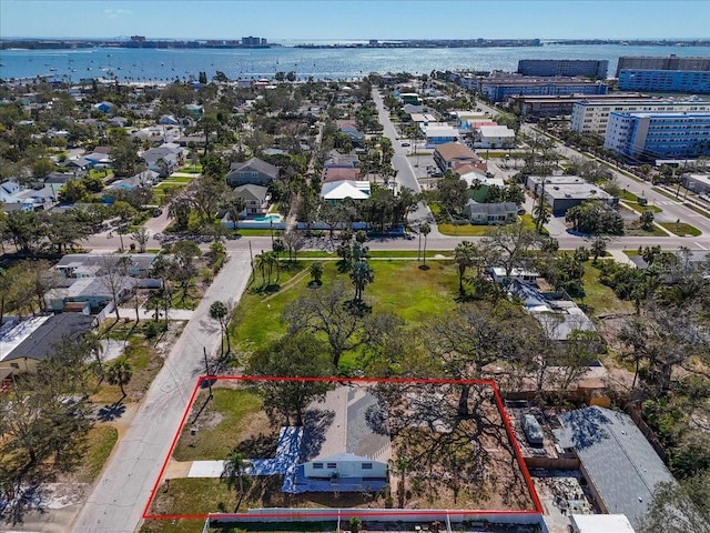 birds eye view of property with a water view