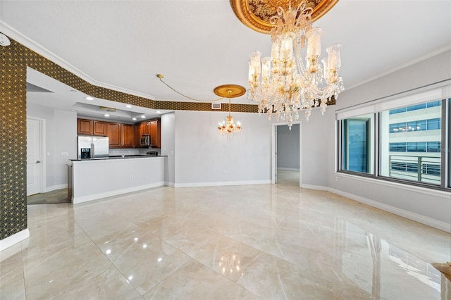 unfurnished living room with an inviting chandelier and crown molding