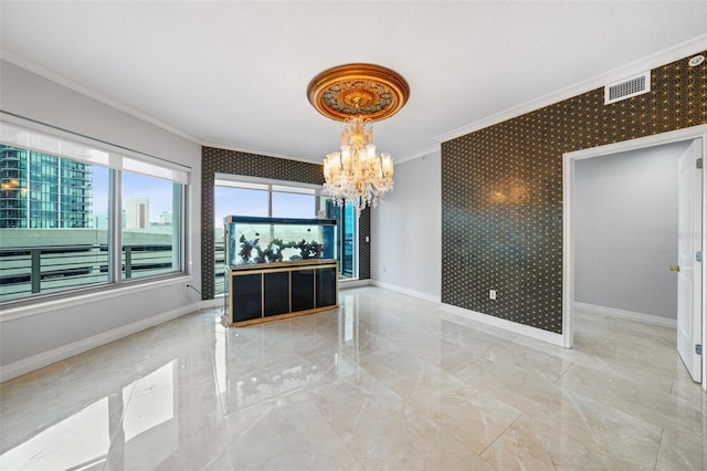 unfurnished dining area with crown molding and a notable chandelier