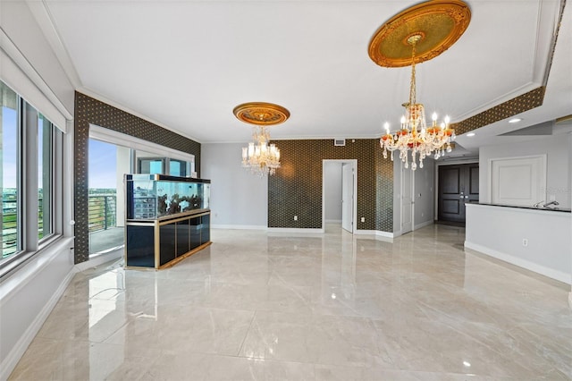 unfurnished dining area featuring ornamental molding and a notable chandelier