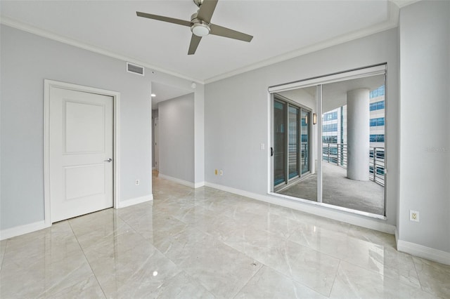 spare room with ceiling fan and ornamental molding