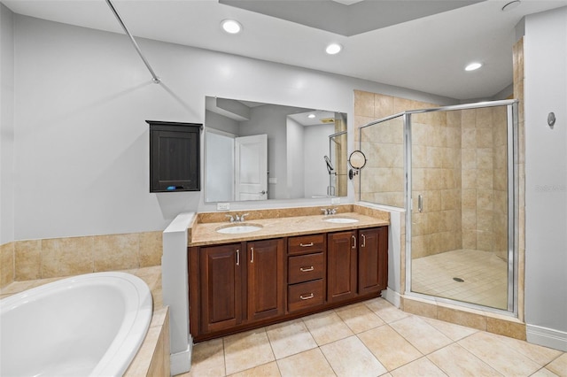 bathroom with tile patterned floors, separate shower and tub, and vanity