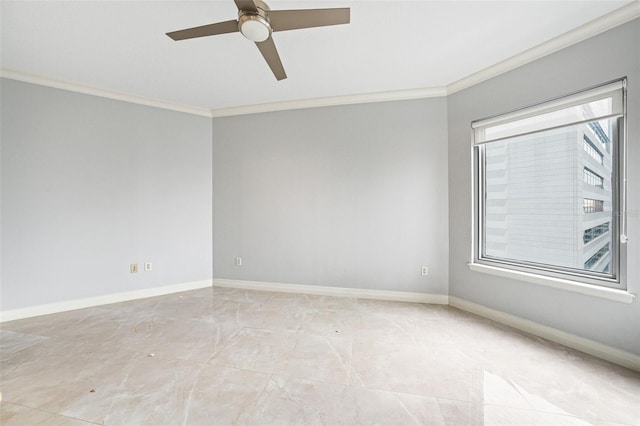 spare room featuring ornamental molding and ceiling fan