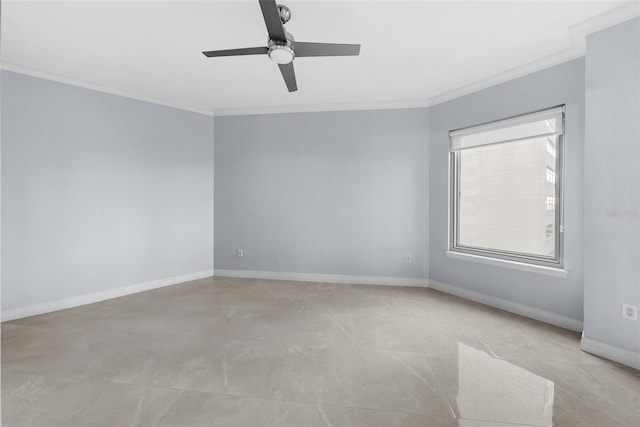 spare room with ornamental molding and ceiling fan