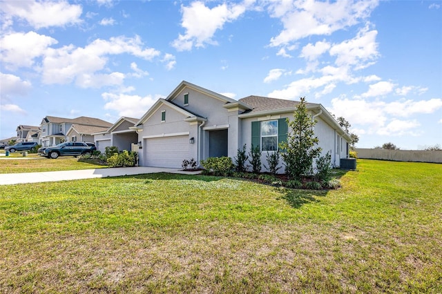 single story home featuring a garage and a front lawn