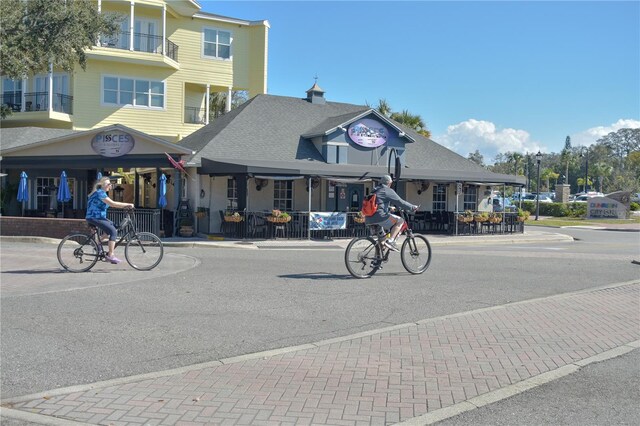 view of street with sidewalks and curbs