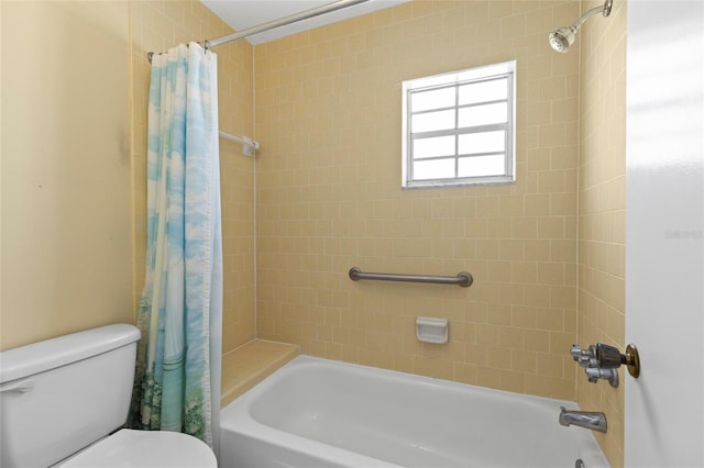 bathroom featuring shower / bath combo and toilet