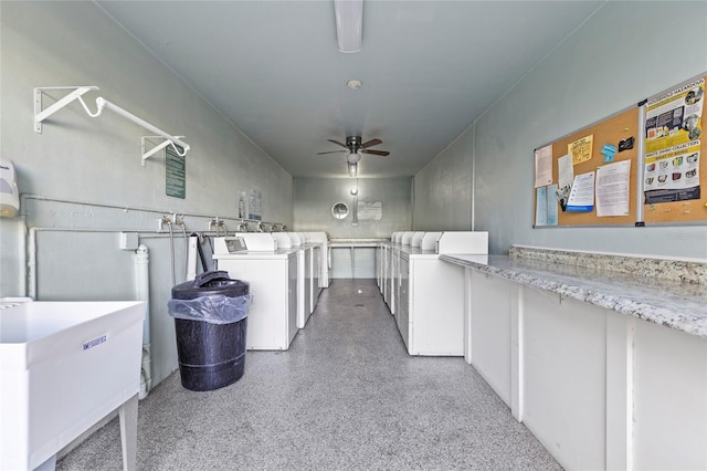 washroom featuring separate washer and dryer, sink, and ceiling fan