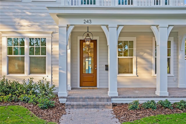 view of exterior entry with a porch