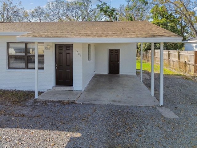 exterior space featuring a carport