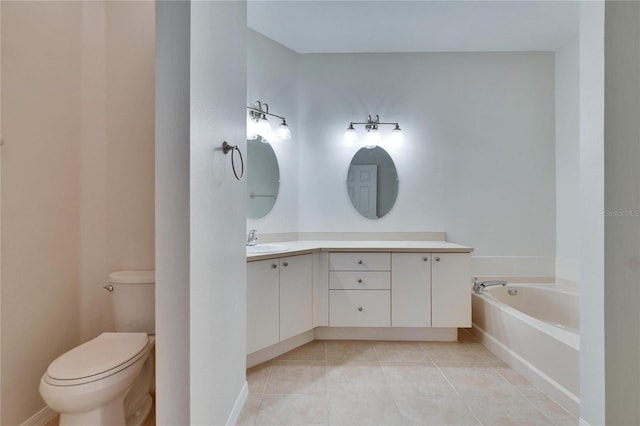 bathroom with tile patterned flooring, vanity, a bathtub, and toilet