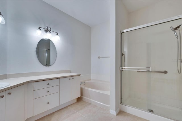 bathroom featuring tile patterned floors, vanity, and independent shower and bath