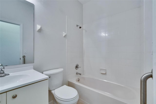 full bathroom featuring tiled shower / bath combo, vanity, and toilet