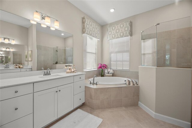 17020 Cape Horn Blvd, Punta Gorda, FL 33955 - bathroom with tile patterned floors, separate shower and tub, and vanity