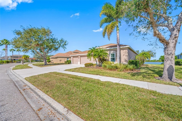 ranch-style home with a garage and a front yard