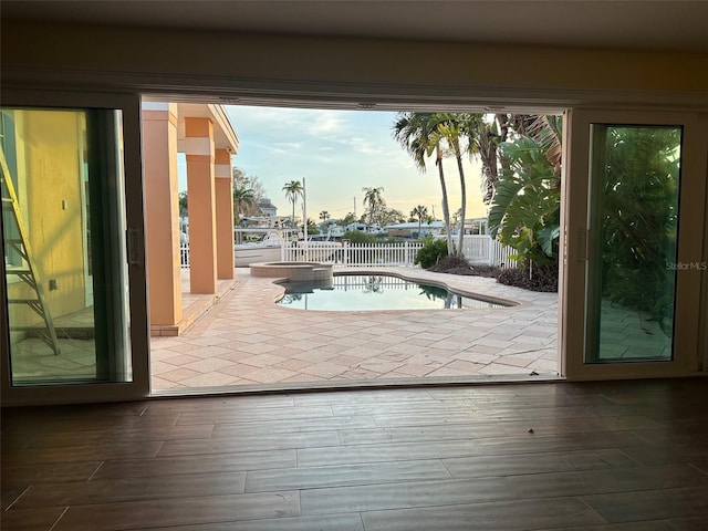 doorway to outside featuring wood-type flooring