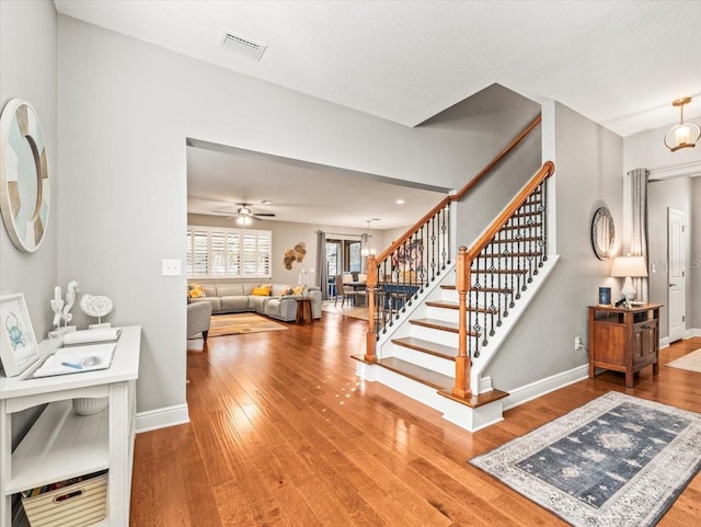 interior space with hardwood / wood-style floors and ceiling fan