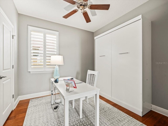 office space with hardwood / wood-style flooring and ceiling fan