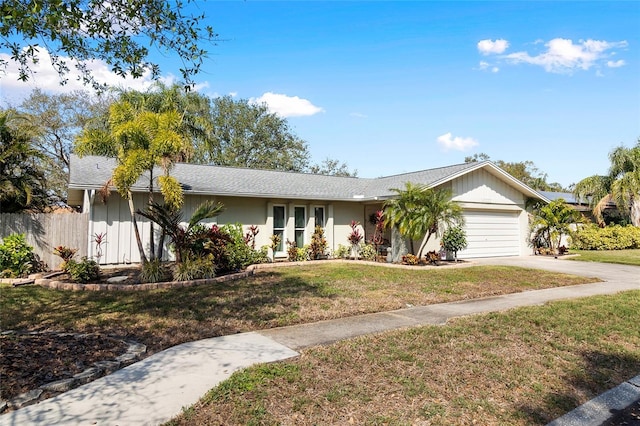 ranch-style home with a garage and a front yard