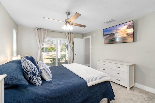 bedroom with access to exterior, light colored carpet, and ceiling fan