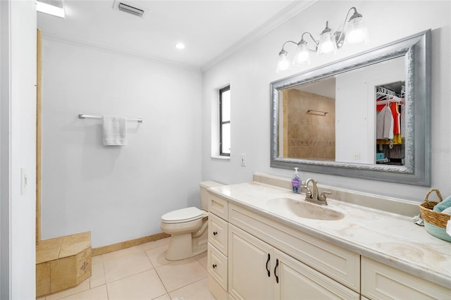 bathroom with crown molding, toilet, tile patterned floors, and vanity