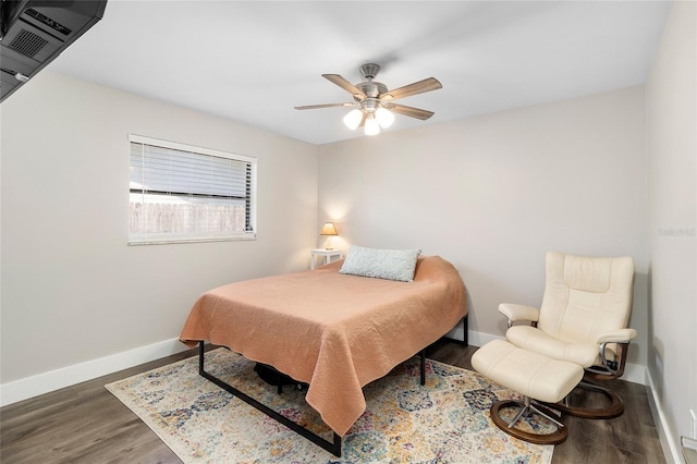 bedroom featuring dark hardwood / wood-style floors and ceiling fan