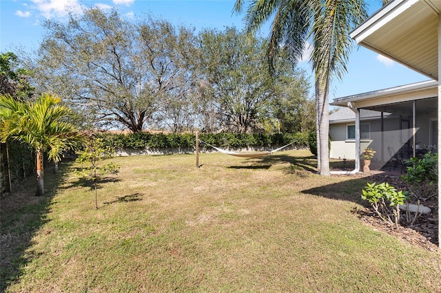 view of yard with a sunroom