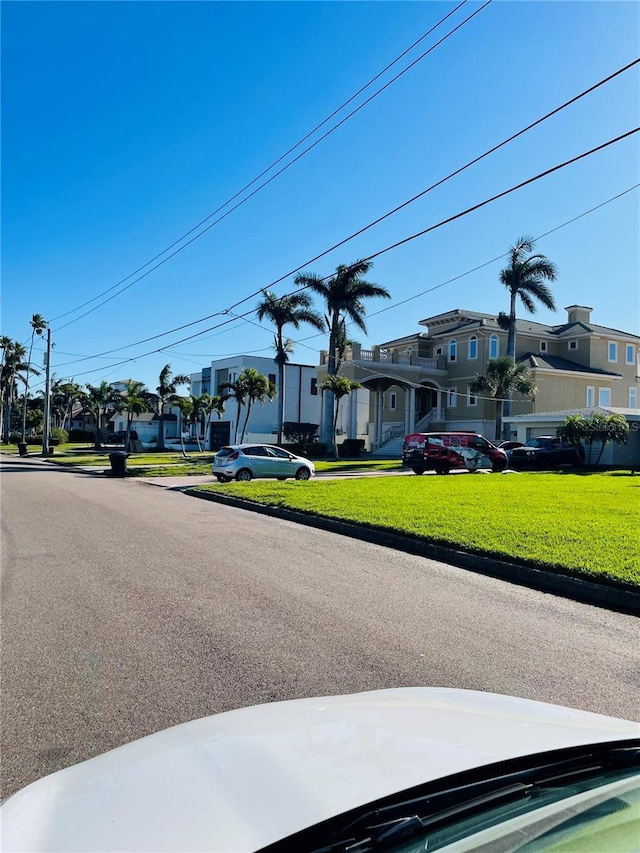 view of street featuring curbs and a residential view