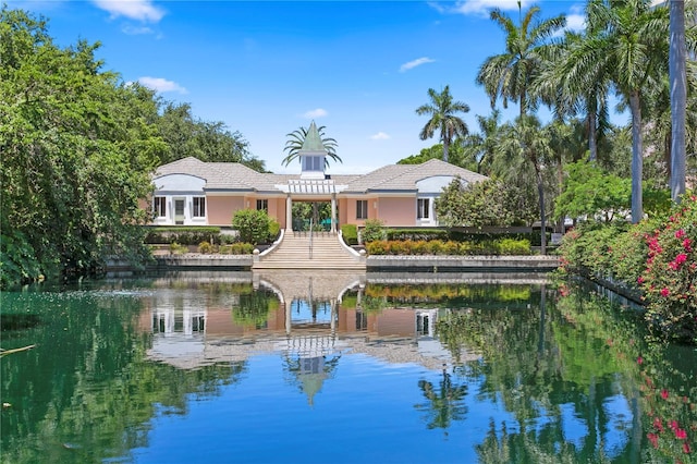 back of house featuring a water view