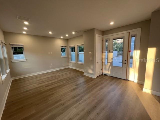 foyer entrance with dark hardwood / wood-style floors