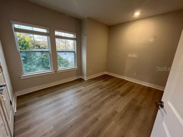 empty room featuring hardwood / wood-style floors