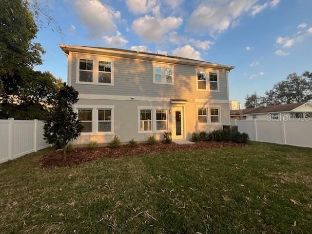 view of front of home with a front lawn