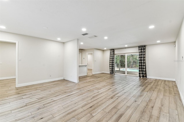 unfurnished living room featuring light hardwood / wood-style flooring