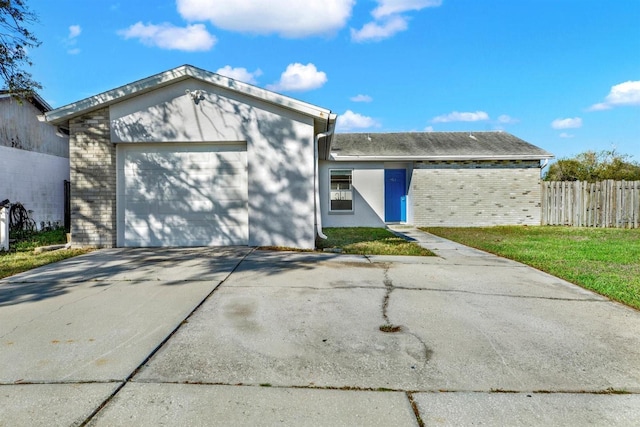 ranch-style home with concrete driveway, brick siding, an attached garage, and fence