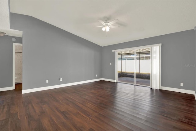 unfurnished room featuring vaulted ceiling, wood finished floors, a ceiling fan, and baseboards