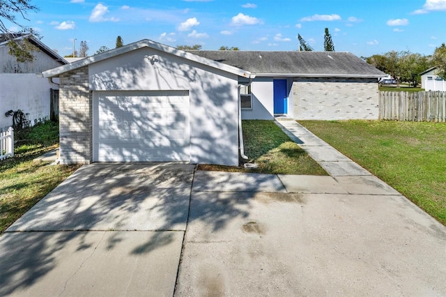 ranch-style house with fence, a front lawn, concrete driveway, and brick siding