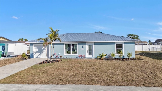 view of front facade featuring a garage and a front lawn