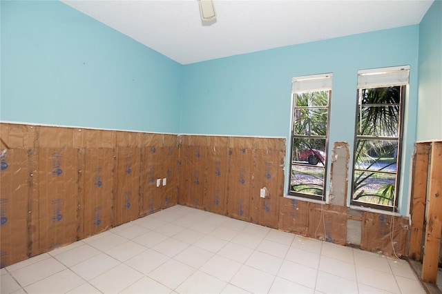 empty room featuring wooden walls