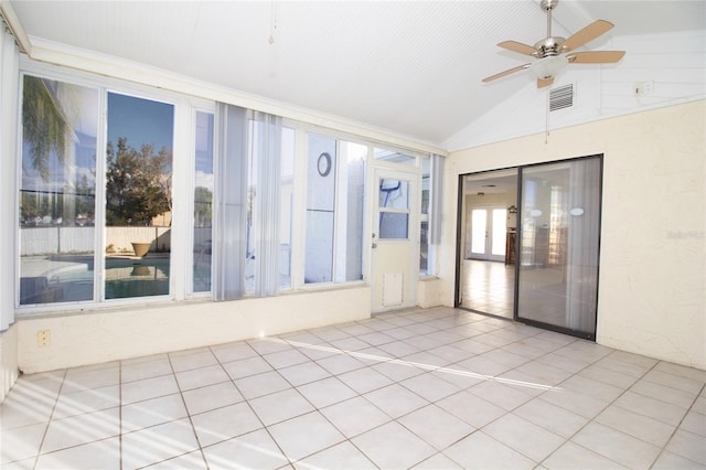 unfurnished sunroom featuring ceiling fan and vaulted ceiling