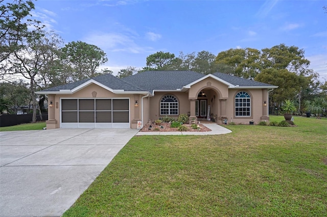 ranch-style house featuring a garage, a front lawn, and stucco siding