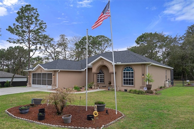 single story home with a garage, concrete driveway, a front lawn, and stucco siding