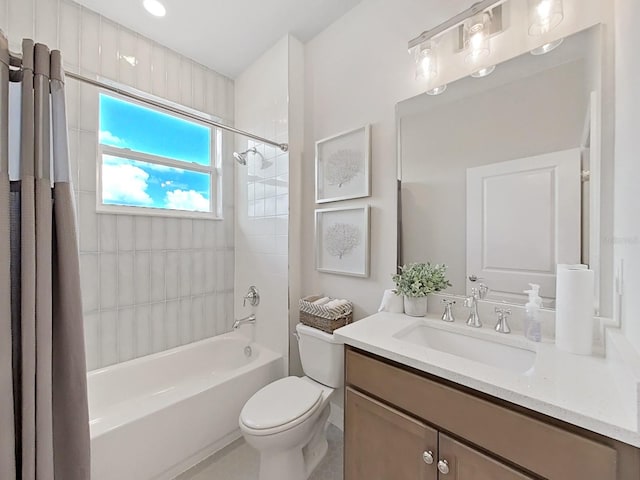 full bathroom featuring toilet, vanity, and shower / bathtub combination with curtain