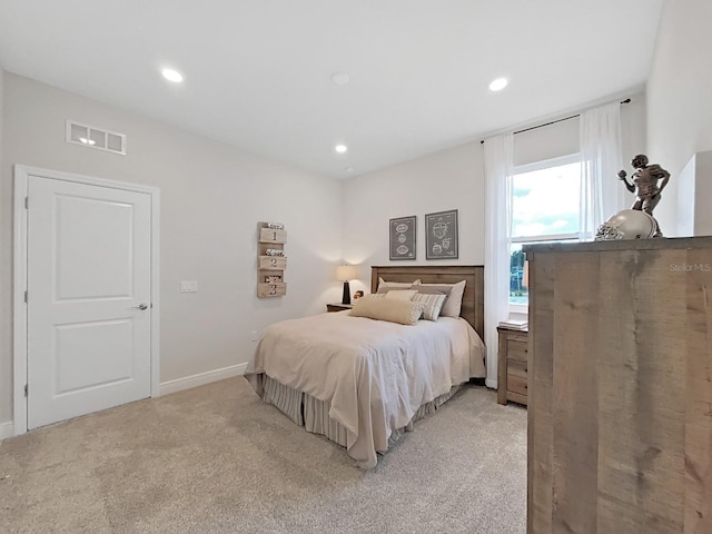 bedroom with light colored carpet