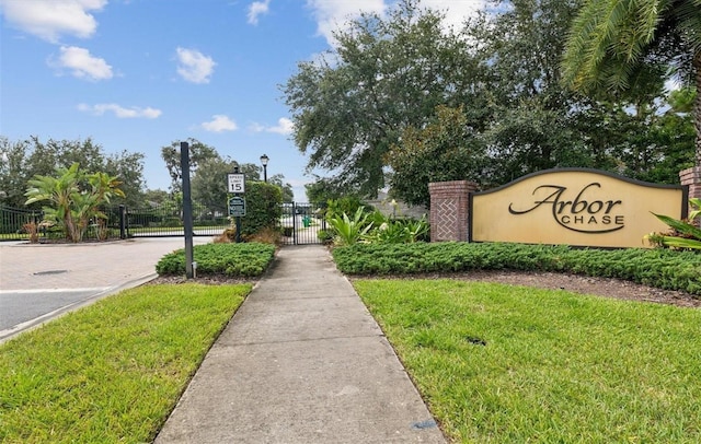 view of property's community featuring a gate and fence