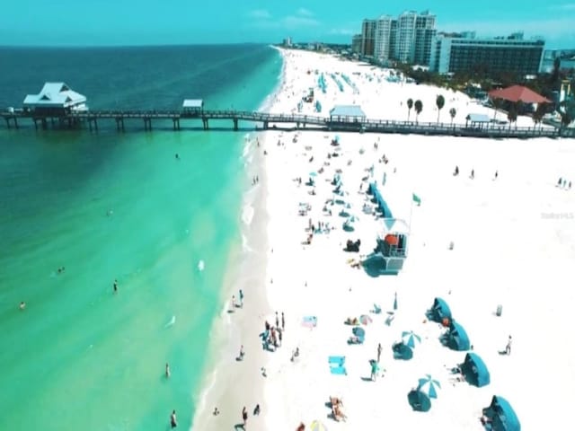 aerial view featuring a water view and a view of the beach