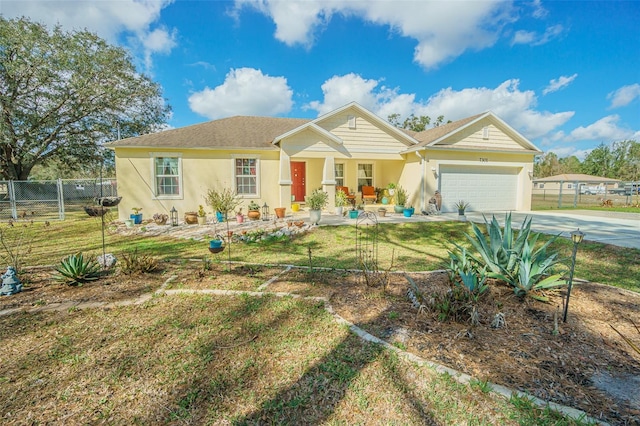 view of front of house with a garage and a front lawn